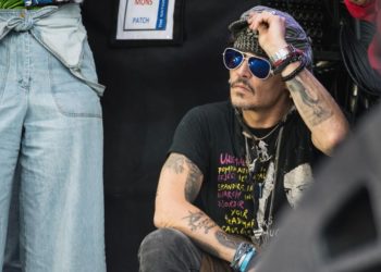 GLASTONBURY, ENGLAND - JUNE 24:  Johnny Depp sits at the side of the Pyramid Stage watching 'Run The Jewels' perform on day 3 of the Glastonbury Festival 2017 at Worthy Farm, Pilton on June 24, 2017 in Glastonbury, England.  (Photo by Ian Gavan/Getty Images)