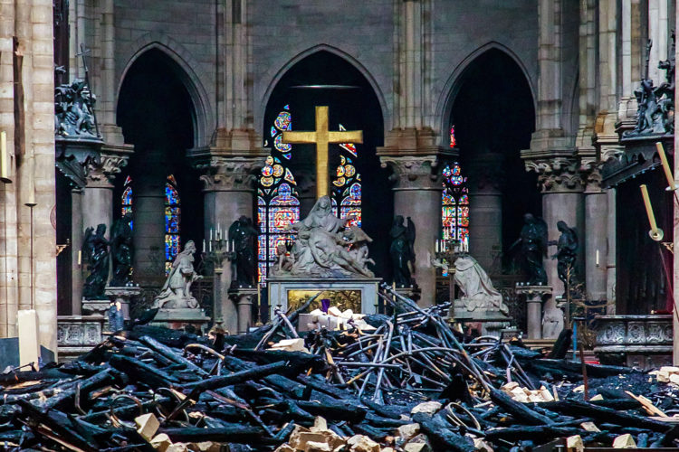 Mandatory Credit: Photo by CHRISTOPHE PETIT TESSON/POOL/EPA-EFE/REX/Shutterstock (10205506cs)
A view of the cross and the sculpture 'Pieta' by Nicholas Coustou behind debris inside the Notre-Dame de Paris in the aftermath of a fire that devastated the cathedral, in Paris, France, 16 April 2019. The fire started in the late afternoon on 15 April in one of the most visited monuments of the French capital.
Cathedral of Notre-Dame of Paris fire aftermath, France - 16 Apr 2019