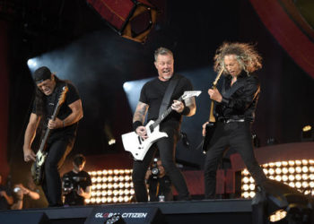 Robert Trujillo, left, James Hetfield, center, and Kirk Hammett of Metallica perform at the Global Citizen Festival in New York., Saturday, Sept. 24, 2016. (AP Photo/Kathy Kmonicek)